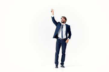 business man in suit with arms raised in air