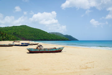 Old fisherman boats on the beach at the day,Samana beach,Dominican Republic.