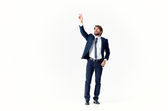 Business Man In Suit With Arms Raised In Air