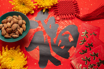 Chinese new year blessing word and badan wood nut background