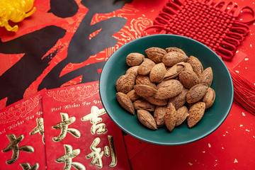 Chinese new year blessing word and badan wood nut background
