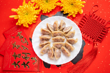 Chinese spring festival cuisine a dish of dumplings and blessing character background material