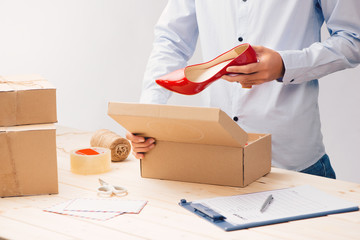 Young business owner packing cardboard box. about shopping online.