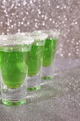 Three glasses with green drinks