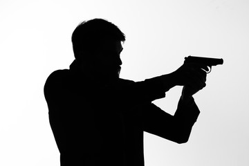 silhouette of a man with gun