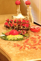 Rose and fruit on the table