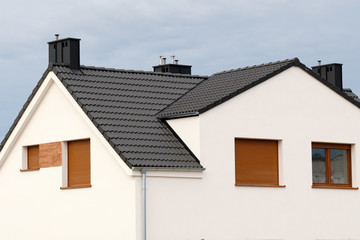 house with black tile roof