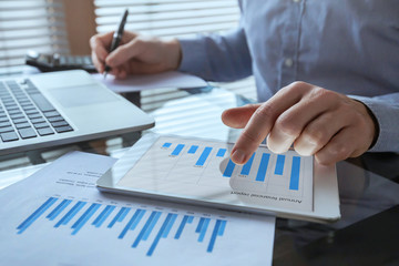 businessman working with financial report charts, business analytics and KPI, finance concept - obrazy, fototapety, plakaty