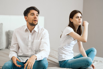 couple sitting on sofa at home