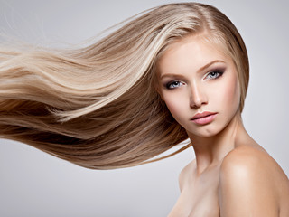 Beautiful young woman with long straight white hair