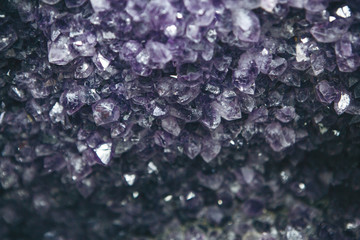 Close-up or macro of a lilac or violet mineral of amethyst druse