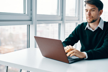 Fototapeta premium businessman working on his laptop in office