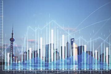 Forex graph on city view with skyscrapers background double exposure. Financial analysis concept.