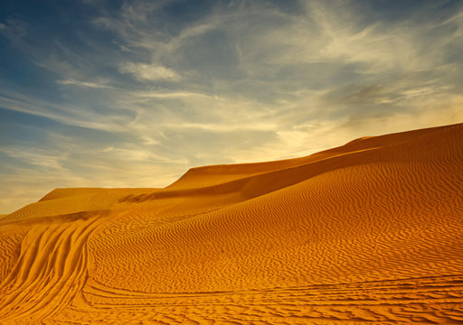 Desert sand dunes road at sunset © bluebeat76
