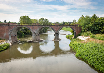 old railway bridge over Lambro river next to Lambrinia village (Chignolo Po), Province of Pavia, Lombardy, Italy