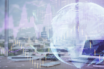 Financial chart drawing and table with computer on background. Double exposure. Concept of international markets.