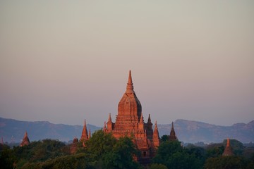 Bagan pagodas with mountains scene at sunset, Bagan, Myanmar