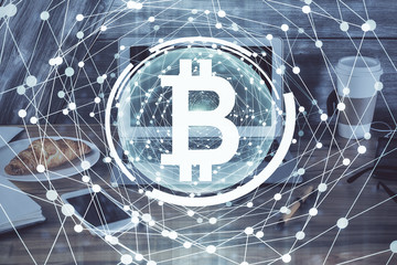 Double exposure of blockchain theme hologram and table with computer background. Concept of bitcoin crypto currency.