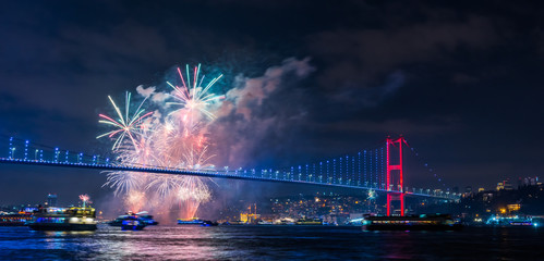 Naklejka premium ISTANBUL, TURKEY. New Year 2020 Celebrations Around the Istanbul. Fireworks with Istanbul Bosphorus Bridge (15th July Martyrs Bridge).