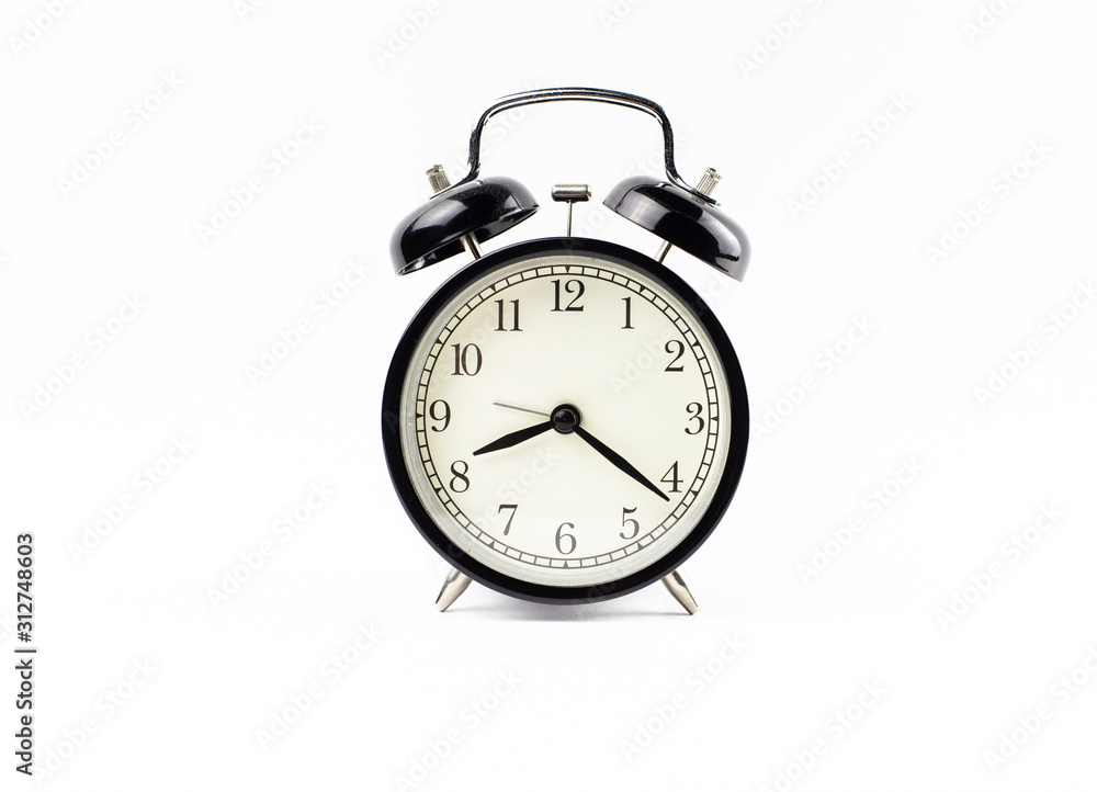 Wall mural Black alarm clock on a white background isolate