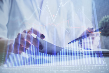 Financial chart drawn over hands taking notes background. Concept of research. Multi exposure