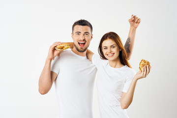 happy woman and man with hands up