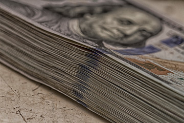 Stacks of one hundred dollars banknotes close-up