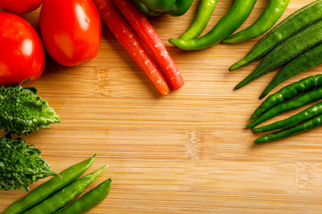 Raw vegetable on wooden board with copy space  