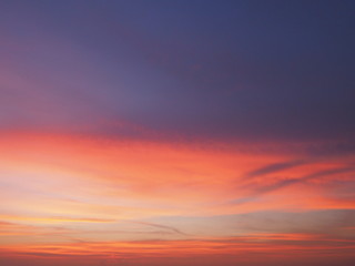 Naklejka na ściany i meble Twilight dusk. Sunset orange sky clouds. Beautiful sky.