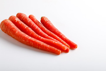 Fresh red carrot bunch on white background 
