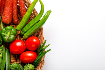 Raw vegetable in wooden basket  