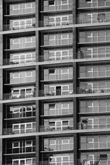 Fototapeta na wymiar Multiple windows on a large apartment building