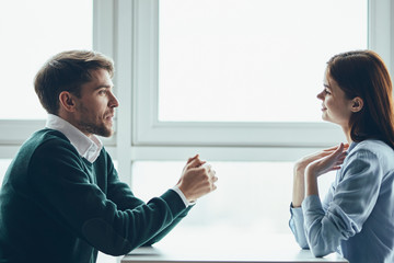 man and woman talking on the phone