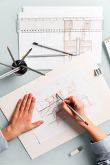 Interior designer drawing pencil sketch of a kitchen - 312758099