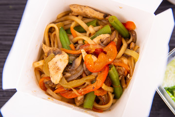 Wok noodles with meat and fresh vegetables