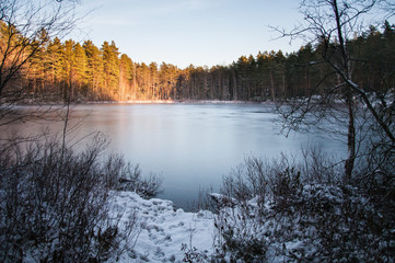 Frozen lake in Sweden during sunset