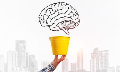 Brain drawing flying above yellow pot