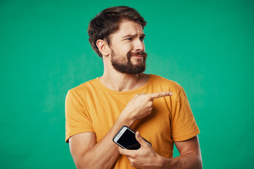 portrait of young man with remote control