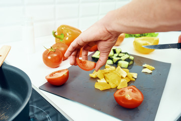 woman cutting vegetables in the kitchen