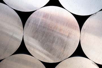 Industrial raw materials, Heap of aluminium bar in aluminum profiles factory - obrazy, fototapety, plakaty