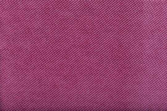 close-up of pink fabric surface, small stitches as background