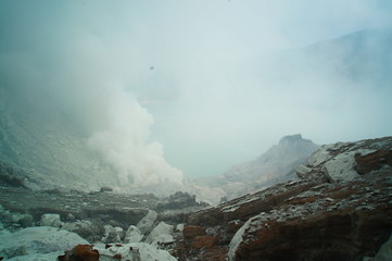 Fototapeta premium Ijen Crater is a acidic crater lake located at the top of Mount Ijen with a lake depth of 200 meters and the area of ​​the crater reaching 5,466 hectares.