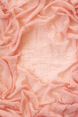 Coral colored voile drapery