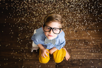 Boy with Glasses and Confetti