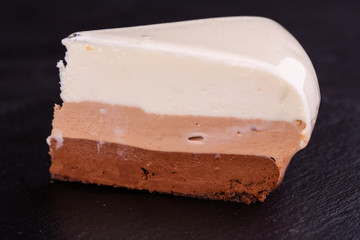 Piece three chocolate with white, milk and bitter chocolate