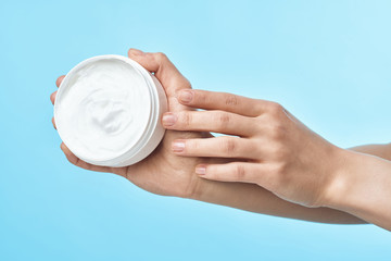 hand with cream isolated on white background