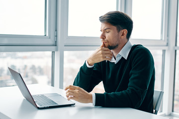 businessman working on his laptop in office