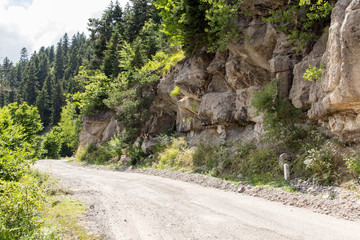 Dirt road in the mountains along the cliffs
