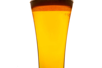 glass cup filled with beer with foam