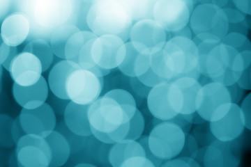 abstract defocused blue vintage bokeh or bubble from light party on stage for background and christmas or xmas festival on cool winter with white snow and sky on retro style
